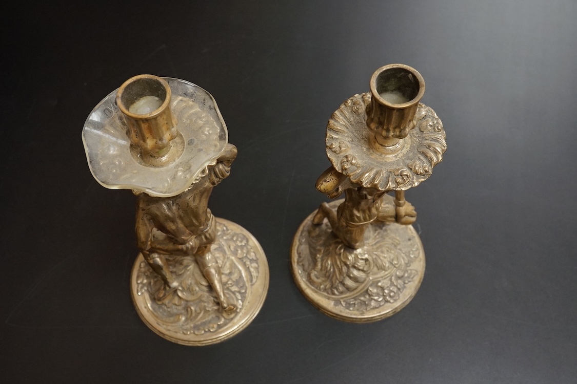 A pair of Blackamoor silvered brass candlesticks, 19cm high